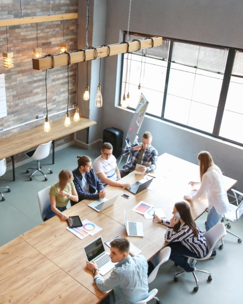 Young people having business meeting in modern office