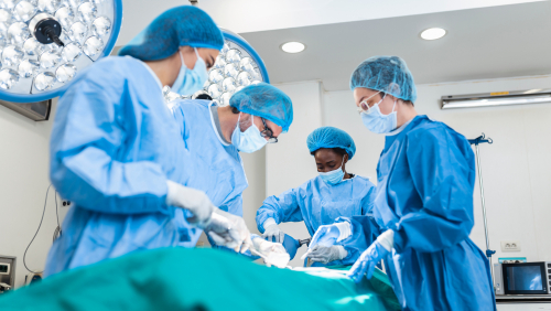 Doctor and assistant nurse operating for help patient from dangerous emergency case .Surgical instruments on the sterile table in the emergency operation room in the hospital.Health care and Medical