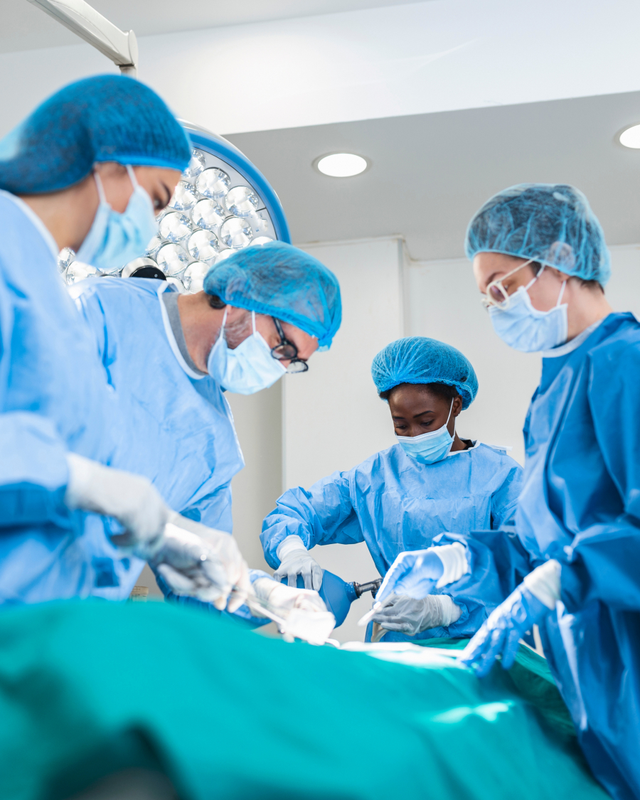 Doctor and assistant nurse operating for help patient from dangerous emergency case .Surgical instruments on the sterile table in the emergency operation room in the hospital.Health care and Medical